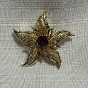Gold Tone Brooch with Amethyst Center